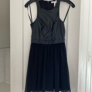 Short BCBGeneration black party dress.  Leather upper body and New with tag.